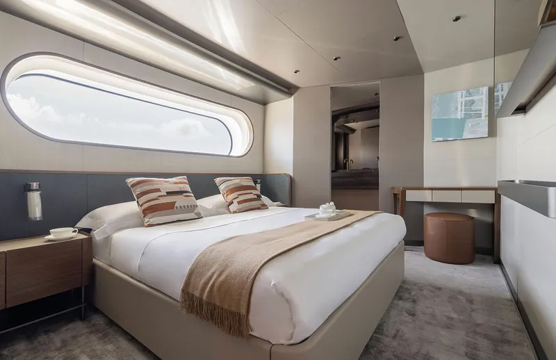  Yacht Photos Pics Luxurious bedroom interior of 2024 Azimut Magellano 30M yacht with modern design and large window.