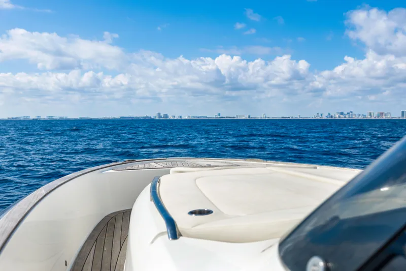  Yacht Photos Pics 2024 Solaris Power 44 yacht cruising on open sea under blue sky.