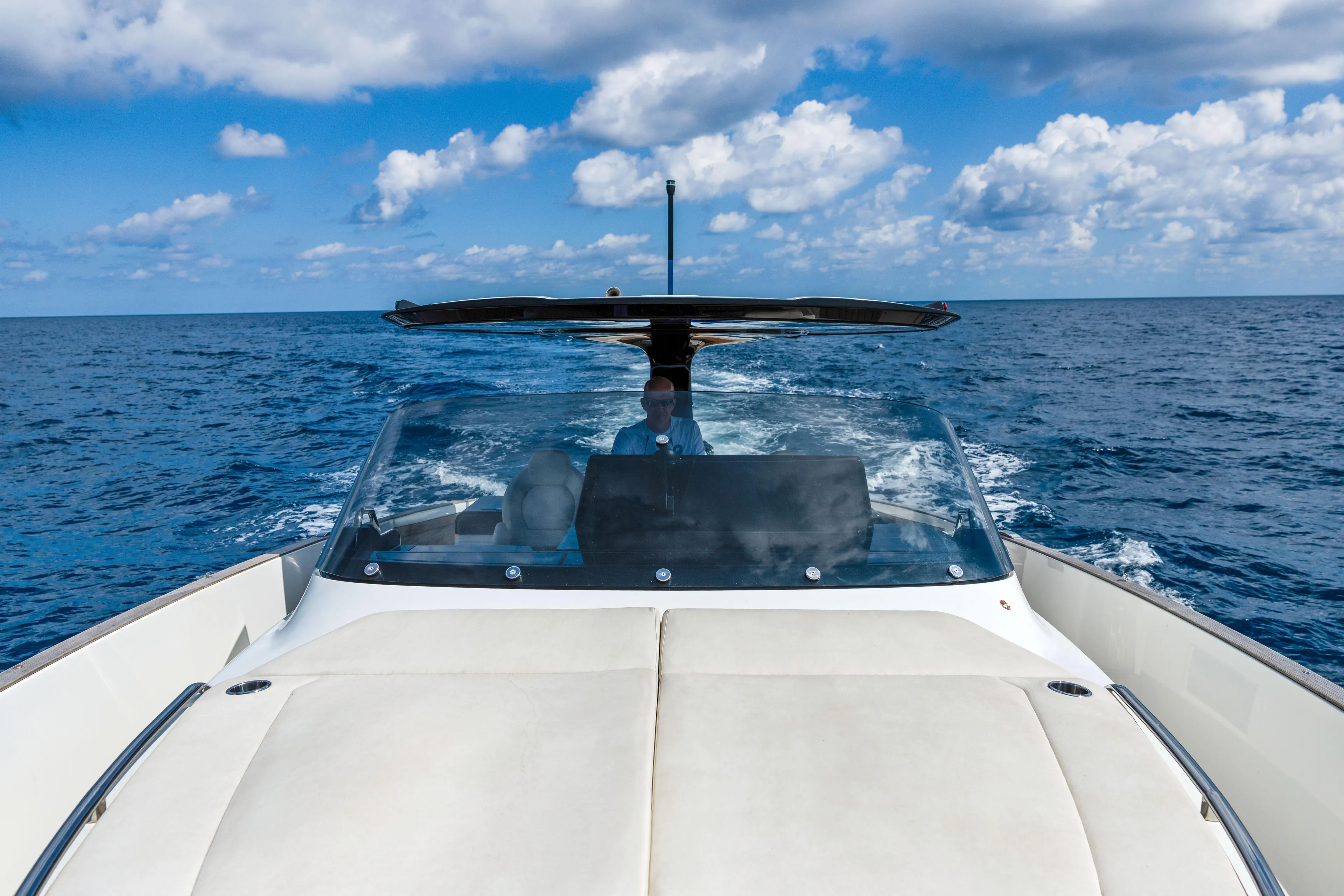  Yacht Photos Pics 2024 Solaris Power 44 yacht cruising on open sea under blue sky.