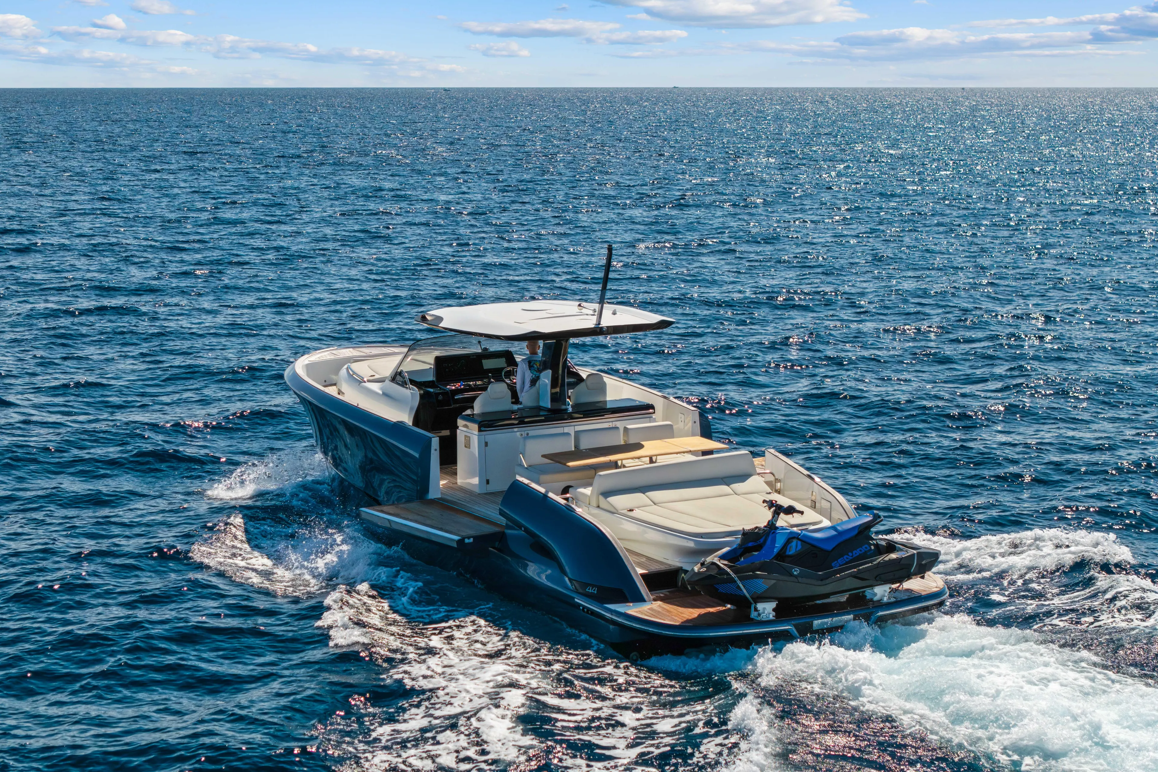 Yacht Photos Pics 2024 Solaris Power 44 yacht cruising on open sea under clear blue sky.