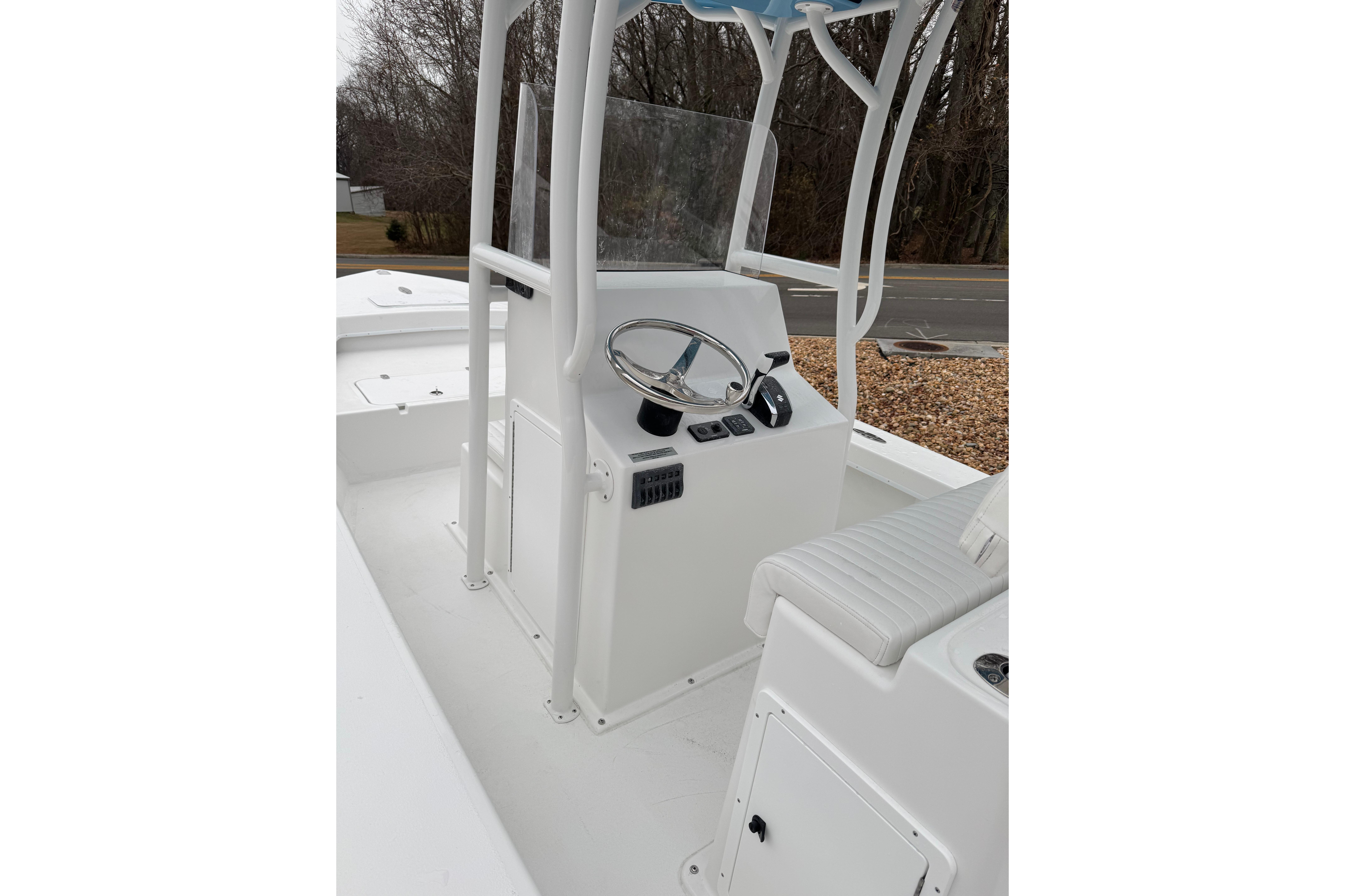 2026 C-Hawk 23 Center Console boat interior with steering wheel and seating.