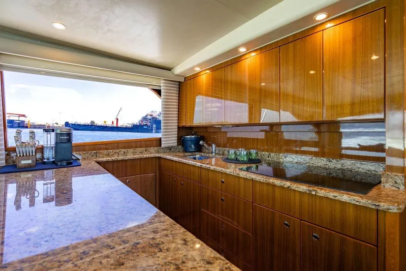 Reel Southern Yacht Photos Pics Luxurious kitchen interior of 2006 Viking 56 Convertible yacht with ocean view.