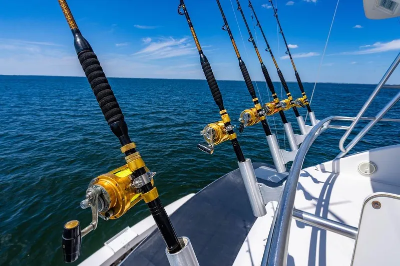 Reel Southern Yacht Photos Pics Fishing rods on a 2006 Viking 56 Convertible boat, ocean view.