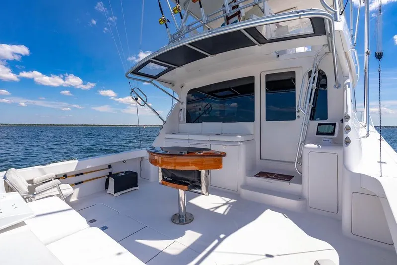 Reel Southern Yacht Photos Pics 2006 Viking 56 Convertible yacht deck with ocean view and fishing equipment.