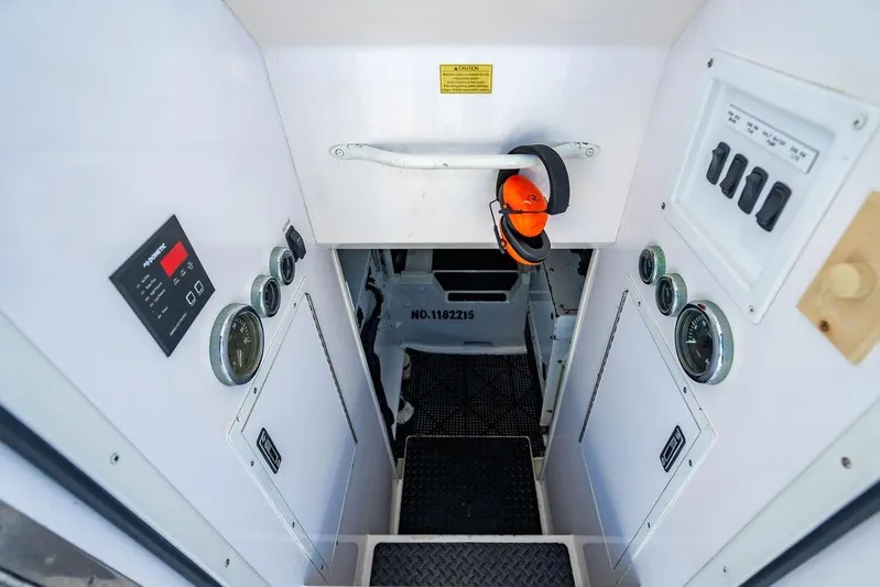 Reel Southern Yacht Photos Pics Engine room access with control panels on a 2006 Viking 56 Convertible yacht.