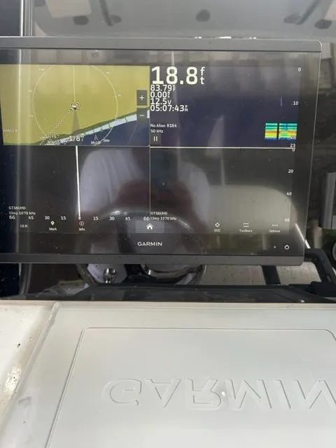 Garmin marine display on 2000 Regulator 23' Center Console boat showing navigation data.