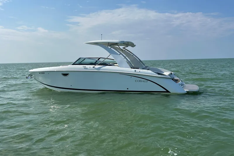  Yacht Photos Pics 2019 Cobalt R30 boat on calm sea under clear sky.