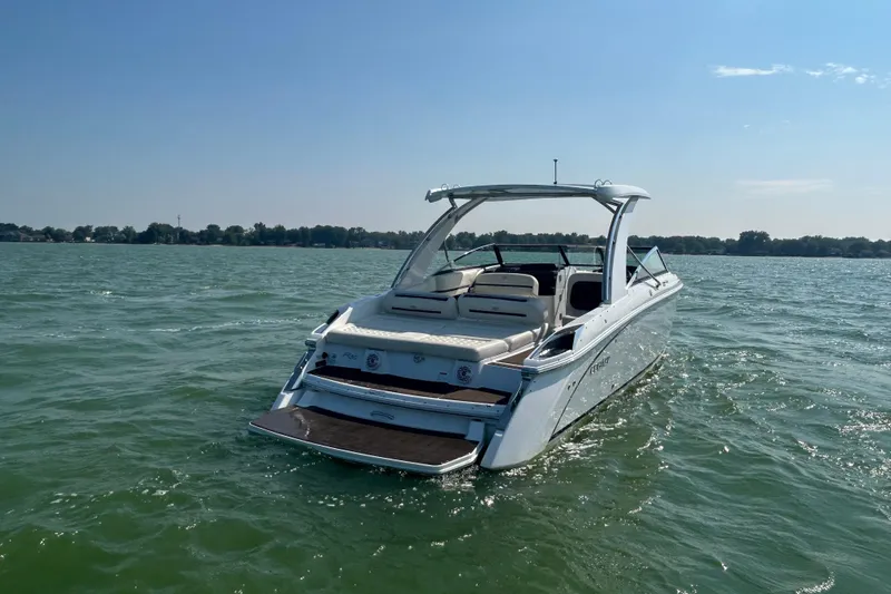  Yacht Photos Pics 2019 Cobalt R30 boat on a sunny lake, showcasing sleek design and open seating.