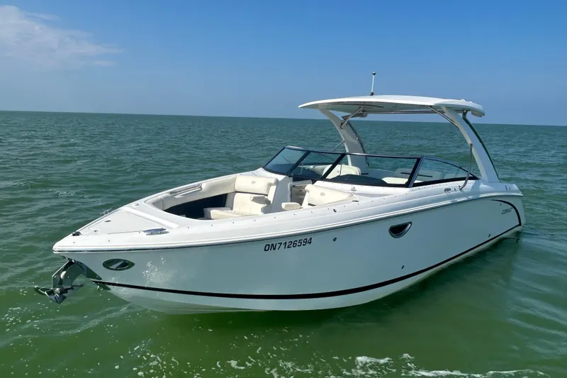  Yacht Photos Pics 2019 Cobalt R30 boat on calm sea under clear blue sky.
