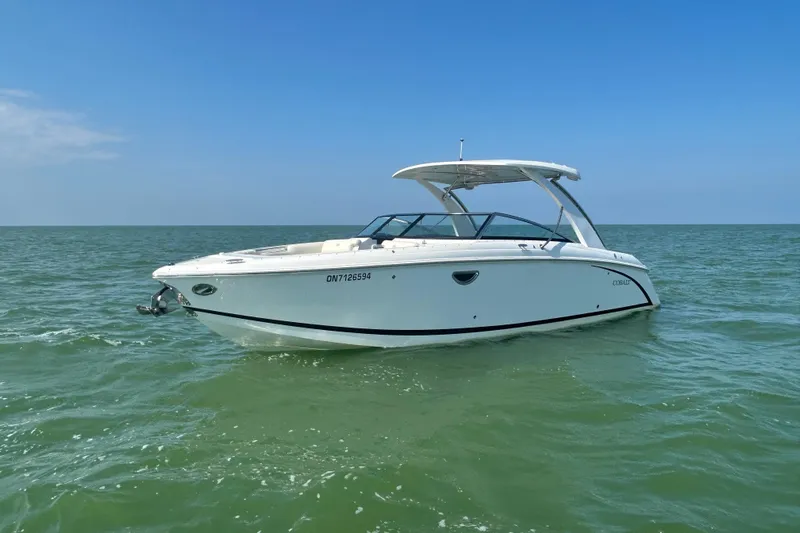  Yacht Photos Pics 2019 Cobalt R30 boat on open water under clear blue sky.