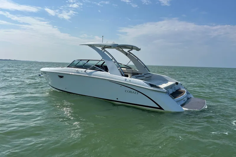  Yacht Photos Pics 2019 Cobalt R30 boat on open water under clear blue sky.