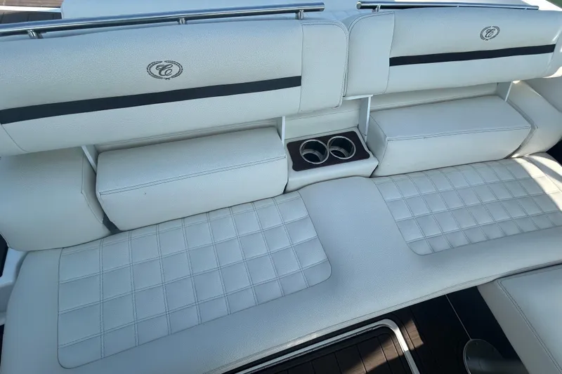  Yacht Photos Pics 2019 Cobalt R30 boat interior with white cushioned seating and cup holders.