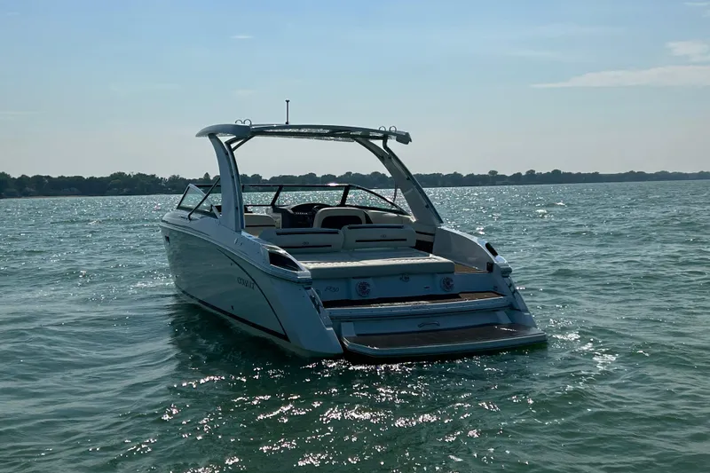  Yacht Photos Pics 2019 Cobalt R30 boat on calm water, rear view, sunny day.