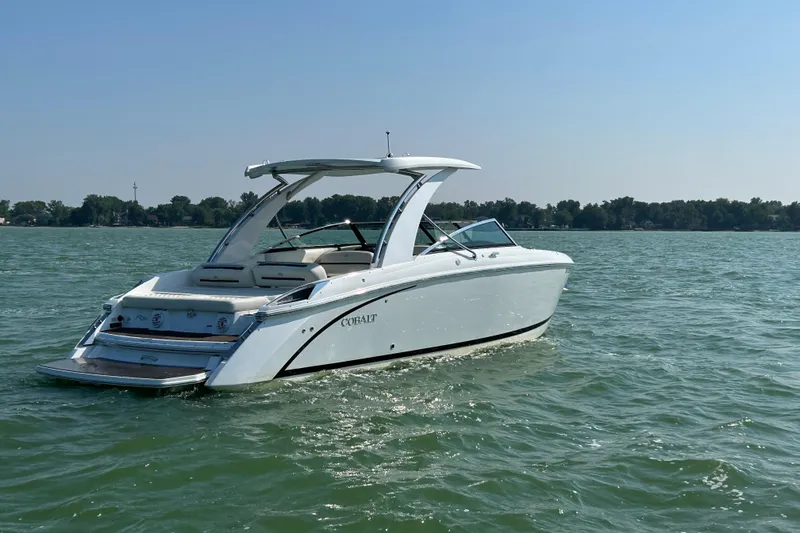 Yacht Photos Pics 2019 Cobalt R30 boat cruising on a sunny lake.