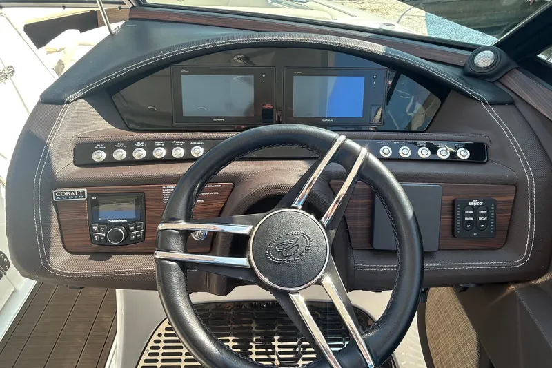  Yacht Photos Pics 2019 Cobalt R30 boat dashboard with steering wheel and control panels.