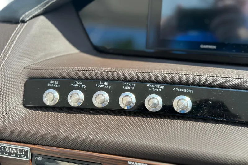  Yacht Photos Pics Dashboard controls of a 2019 Cobalt R30 boat, featuring various function buttons.