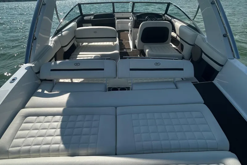  Yacht Photos Pics 2019 Cobalt R30 boat interior with luxurious white seating on the water.