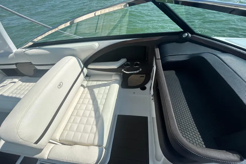  Yacht Photos Pics 2019 Cobalt R30 boat interior with white leather seating and cup holders.