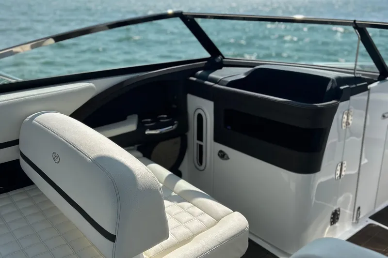  Yacht Photos Pics 2019 Cobalt R30 boat interior with white seating and ocean view.