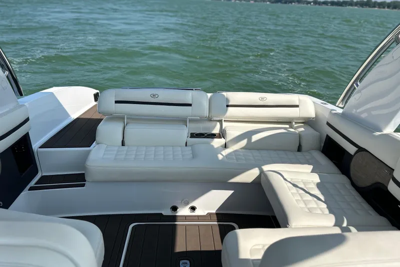  Yacht Photos Pics Luxurious interior of a 2019 Cobalt R30 boat with white seating on a lake.