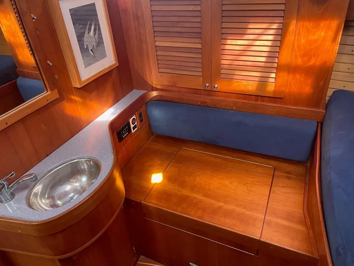 Caribou Yacht Photos Pics Interior of 2001 Sabre 402 yacht with wooden cabinetry and compact sink.
