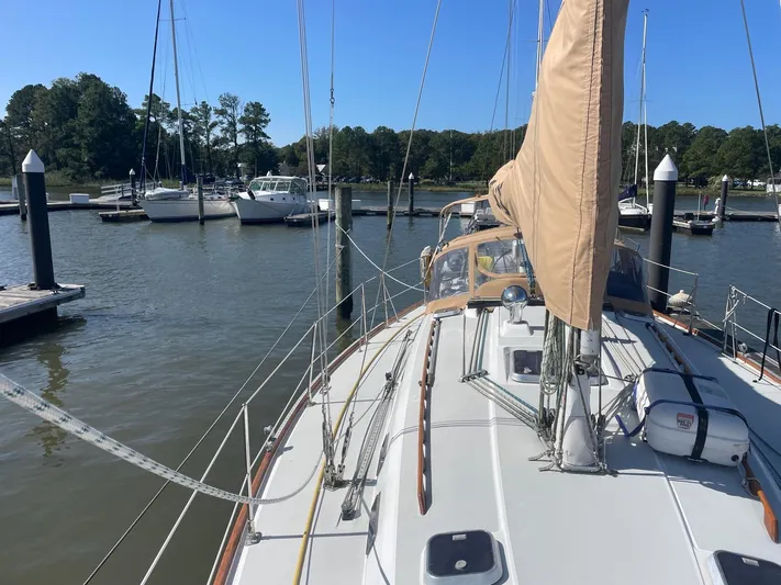 Caribou Yacht Photos Pics Sailboat docked at marina, Sabre 402, 2001 model, with clear blue sky.