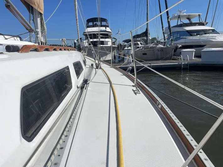 Caribou Yacht Photos Pics Sailboat deck view of 2001 Sabre 402, docked among other yachts in a marina.