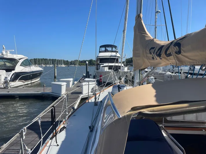Caribou Yacht Photos Pics Sailboat docked at marina, Sabre 402, 2001 model, sunny day, other boats nearby.