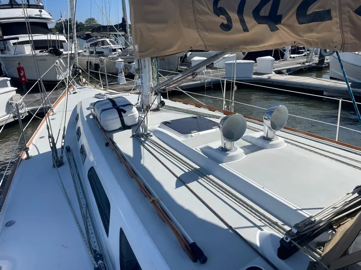 Caribou Yacht Photos Pics Sailboat Sabre 402, 2001 model, docked at marina with visible deck and rigging.