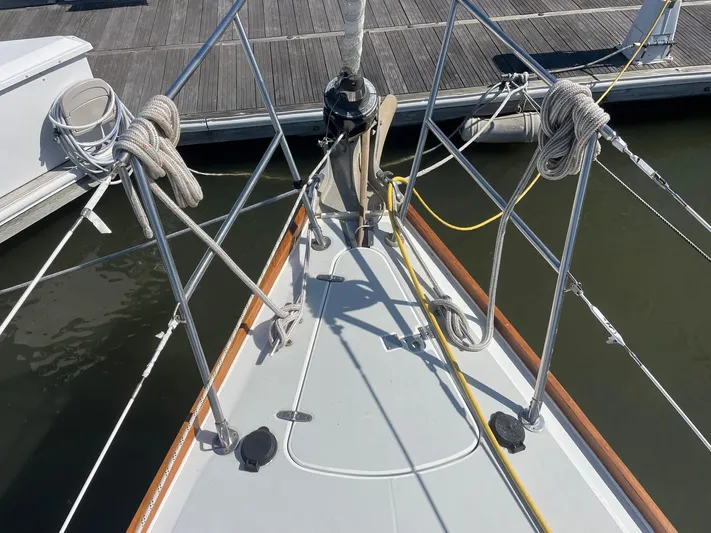 Caribou Yacht Photos Pics Bow of 2001 Sabre 402 sailboat docked, featuring ropes and deck fittings.