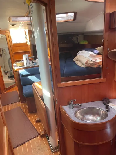 Caribou Yacht Photos Pics Interior of 2001 Sabre 402 sailboat with wood finish and compact living space.