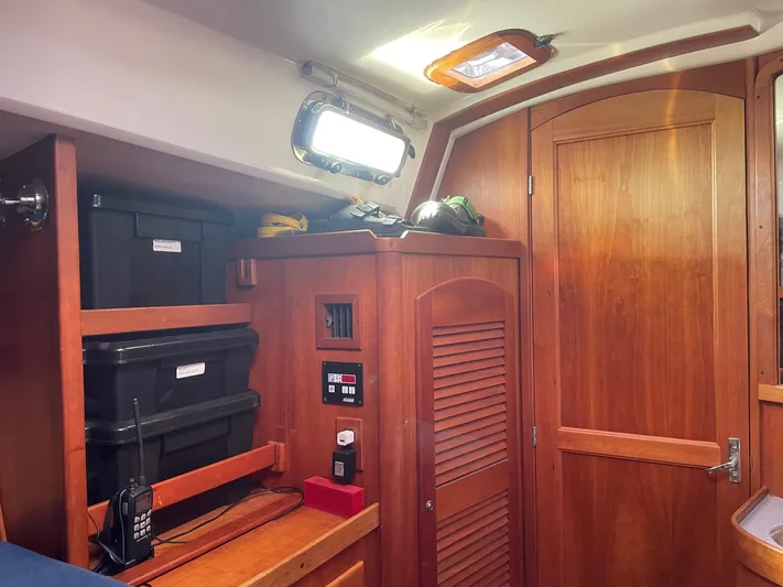 Caribou Yacht Photos Pics Interior of 2001 Sabre 402 sailboat with wooden cabinetry and storage compartments.
