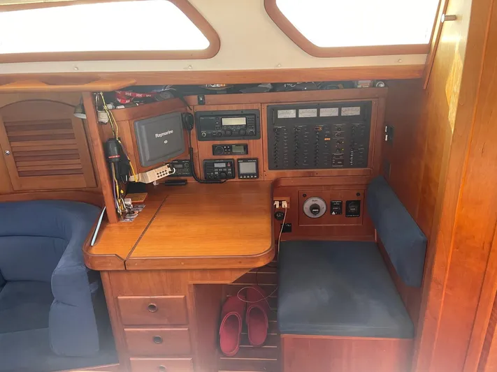 Caribou Yacht Photos Pics Interior of 2001 Sabre 402 sailboat with navigation station and seating area.