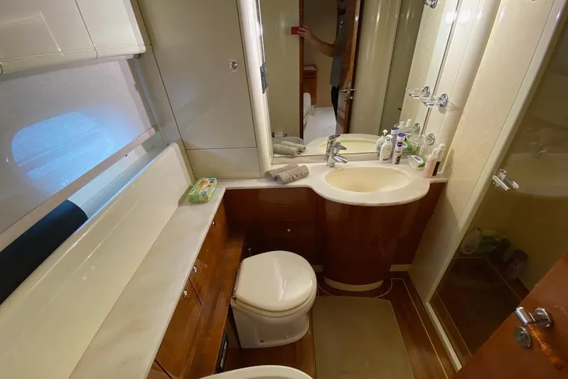 Ukiyo Yacht Photos Pics Luxurious bathroom in 2002 Ferretti Yachts 68, featuring modern amenities and elegant design.