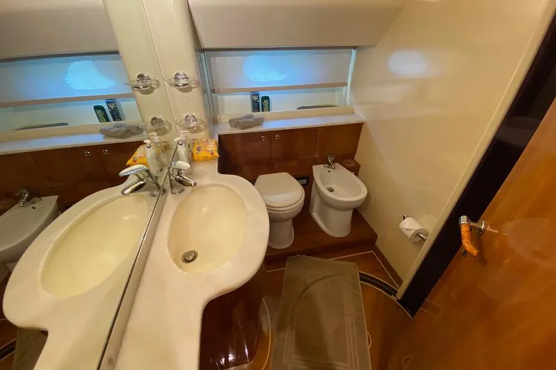 Ukiyo Yacht Photos Pics Luxurious bathroom in 2002 Ferretti Yachts 68, featuring modern fixtures and elegant design.