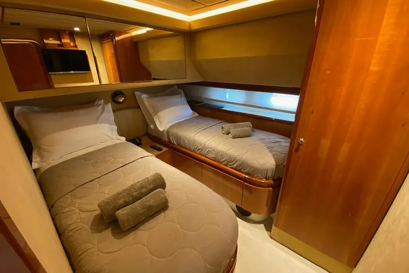 Ukiyo Yacht Photos Pics Luxurious twin cabin interior of 2002 Ferretti Yachts 68, featuring elegant wood finishes.