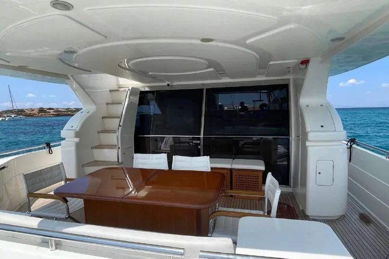 Ukiyo Yacht Photos Pics Luxurious 2002 Ferretti Yachts 68 with elegant outdoor seating and ocean view.