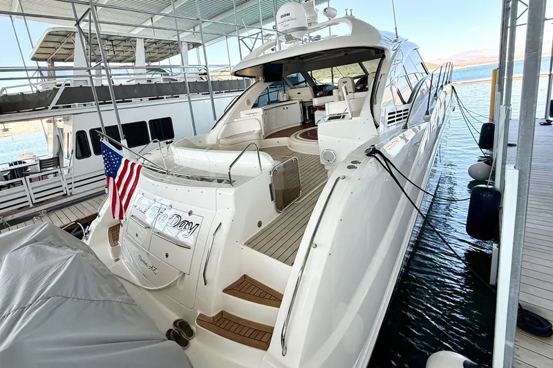 Seas The Day Yacht Photos Pics Luxurious 2014 Sea Ray 580 Sundancer yacht docked, featuring sleek design and American flag.