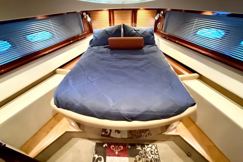 Seas The Day Yacht Photos Pics Luxurious cabin interior of 2014 Sea Ray 580 Sundancer yacht with blue bedding.