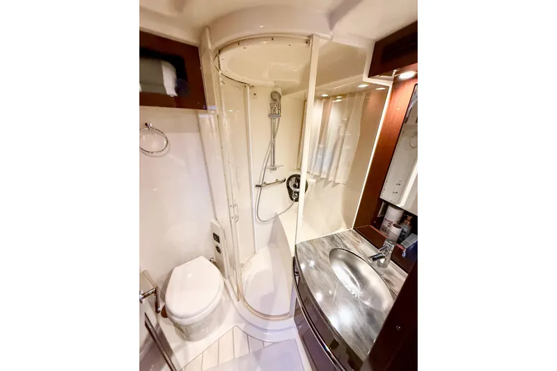 Seas The Day Yacht Photos Pics Luxurious bathroom in 2014 Sea Ray 580 Sundancer yacht with shower and sink.