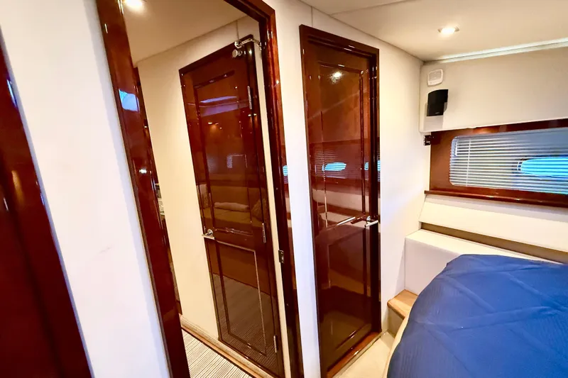 Seas The Day Yacht Photos Pics Luxurious interior of 2014 Sea Ray 580 Sundancer yacht with polished wood finishes.