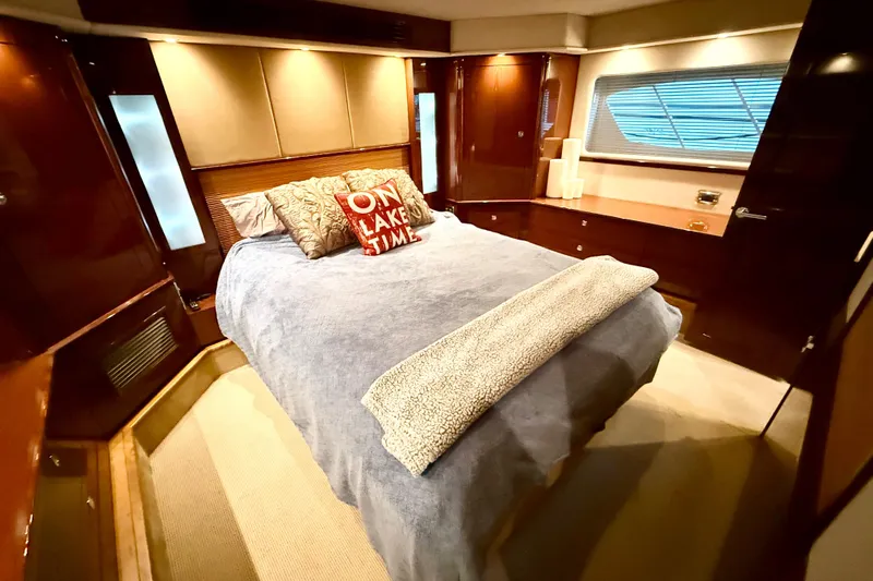 Seas The Day Yacht Photos Pics Luxurious bedroom interior of 2014 Sea Ray 580 Sundancer yacht with cozy bedding.