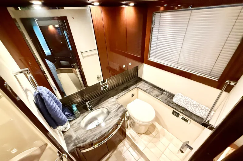 Seas The Day Yacht Photos Pics Luxurious bathroom in 2014 Sea Ray 580 Sundancer yacht with modern fixtures and elegant design.