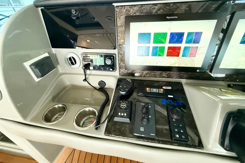 Seas The Day Yacht Photos Pics Control panel of 2014 Sea Ray 580 Sundancer with navigation screens and controls.