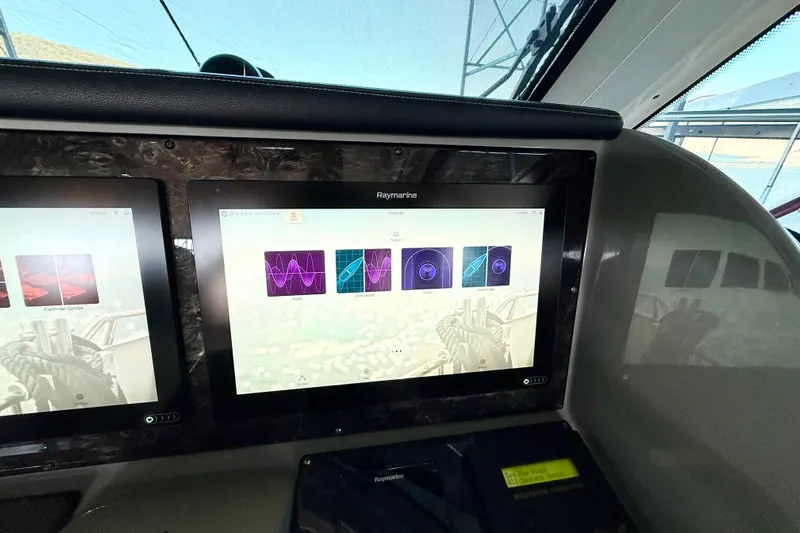 Seas The Day Yacht Photos Pics Raymarine navigation display on 2014 Sea Ray 580 Sundancer yacht dashboard.