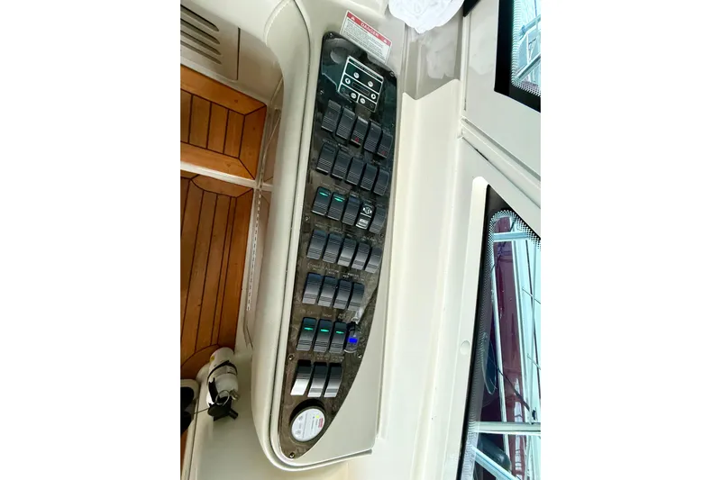 Seas The Day Yacht Photos Pics Control panel of a 2014 Sea Ray 580 Sundancer yacht, featuring multiple switches and gauges.