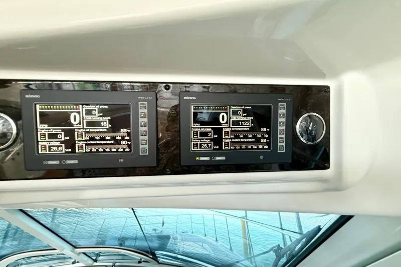 Seas The Day Yacht Photos Pics Control panel of a 2014 Sea Ray 580 Sundancer yacht, displaying engine metrics.