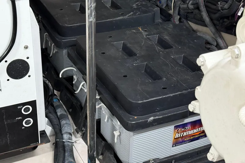 Seas The Day Yacht Photos Pics 2014 Sea Ray 580 Sundancer engine room with heavy-duty batteries and wiring.