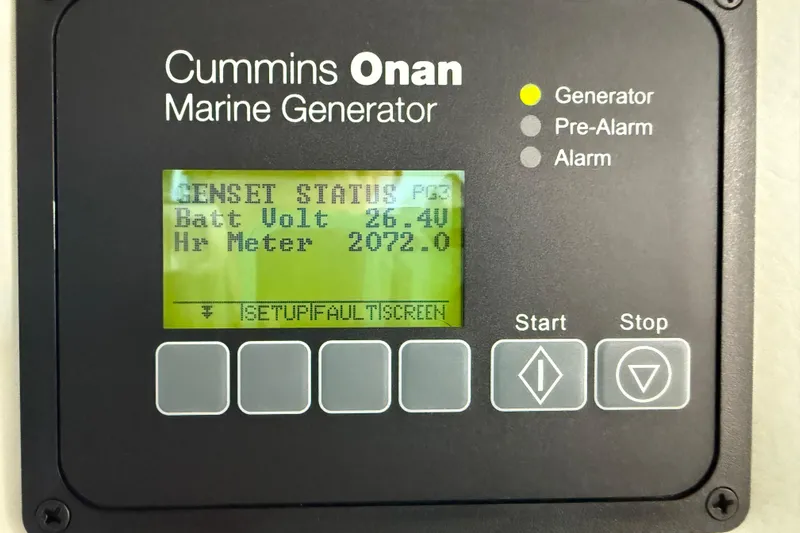 Seas The Day Yacht Photos Pics Cummins Onan marine generator display on 2014 Sea Ray 580 Sundancer, showing battery voltage and hour meter.