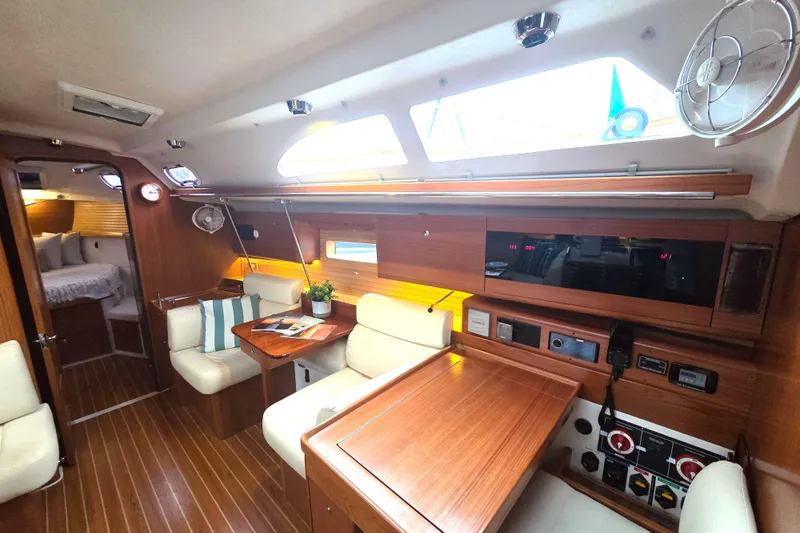 Here & Now Yacht Photos Pics Interior of 2021 Catalina 445 sailboat with wood finish and modern amenities.